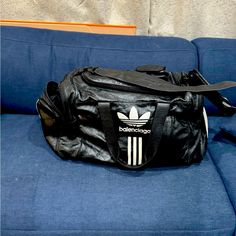 Slightly Used Balenciaga Adidas Duffle Bag Luxury Black Sporty Duffle Bag, Black On-the-go Duffle Bag, Luxury Black Nylon Duffle Bag, Adidas Duffle Bag, Balenciaga Adidas, Black Duffle Bag With Detachable Handle For On-the-go, Bags Balenciaga, Balenciaga Black Bag Farfetch, Balenciaga Bag