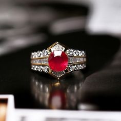 *Condition: Brand new *Center Stone: Natural Ruby from Myanmar, Oval Cut, approx 1.3 total *Side Stone: Natural White Diamond, Round Cut & Baguette Cut, approx 0.8ct total (VS1 clarity and F color) *Ring Dimension: approx 12 x 5mm (thickness) *Ring Weight: 5.2g (depend the ring size) *Metal Purity: Optional *Each piece is made-to-order with care and special attention to detail. all items are made with conflict-free diamonds and gems. *The item will be gift wrapped and shipped. -------------- Ballerina Ring, Blood Ruby, Handmade Gold Ring, Luxury Jewelry Box, Buying An Engagement Ring, Baguette Cut, Color Ring, Ruby Ring, Natural Ruby