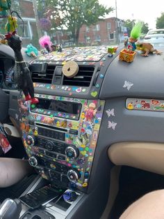 the interior of a car decorated with stickers and decorations