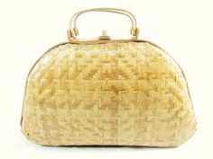 "This is such a sweet purse, a timeless classic coated wicker with bamboo accents. Inside is not lined, in good condition, Good quality. Size-11.5\" base, 9\" tall, 3.5\" deep, These purses look great with a summer dress, or jeans and a t shirt. Looks to be from 1950-60s." Gold Straw Bag With Bamboo Handle, Gold Rectangular Straw Bag With Bamboo Handle, Vintage Straw Bag With Bamboo Handle, Vintage Natural Straw Bag With Handles, Vintage Basket Straw Bag, Vintage Straw Bag With Braided Handles, Vintage Natural Handheld Straw Bag, Vintage Straw Bag With Bamboo Handle For Everyday Use, Vintage Straw Basket Bag