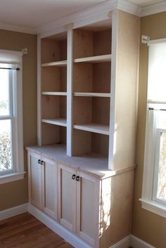 an empty room with bookshelf built in closet shelvings on the wall