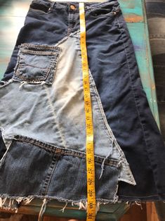 a pair of jeans with a measuring tape on them