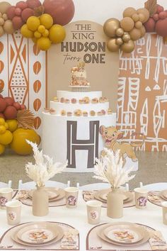 a table topped with plates and cups filled with cake