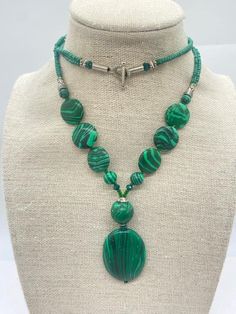 Malachite Necklace: Material: Gemstone Stone: Malachite  Color: Green Shape: Necklace Used for:  Wearing in a Normal Daily Routine life and any Special occasion These items are made from original and Natural Malachite. It is handmade. Malachite is a mineral that naturally forms above copper deposits deep in the earth. For this reason, you will find it in Caverns or cavities, deep within caves. In most situations, Malachite is found inside limestone alongside other minerals like Azurite, calcite, Green Malachite Necklace With Natural Stones, Handmade Green Malachite Necklaces, Green Malachite Handmade Necklace, Luxury Handmade Malachite Necklace, Crystal Protection, Luxury Green Malachite Necklace, Routine Life, Handmade Beaded Necklace, Malachite Necklace