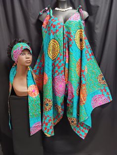 Africa Print jumpsuit with matching headwrap/belt. Colors orange, black, red, blue, teal blue, yellow, purple and maroon.  print fabric. 100% cotton. Tie strap shoulders. Step on wear or wear with top or leggins. Looks good with sandals or boots. All year round all occasions.  One size fits most Large to 3XL.  Style js01 Fitted Summer Beach Headwrap, Casual Fitted Headwrap For Summer, Casual Fitted Headwrap For Spring, Fitted Casual Headwrap For Spring, Fitted Casual Summer Headwrap, Spring Casual Fitted Headwrap, Summer Cotton Fitted Headwrap, Fitted Cotton Headwrap For Summer, Fitted Multicolor Headwrap For Summer