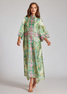 Look effortlessly glamorous in this twill mock neck caftan dress! Crafted from a breathable silk material and flowy sleeves, this dress is perfect for spring and summer with its colorful paisley design. Pair with gold, nude, or black heels to complete the look. Details: Relaxed Fit Mock Neckline 3/4 Length Sleeve Maxi Length Asymmetrical Hemline Synthetic Dry Clean Summer Silk Dress With Paisley Print, Elegant Paisley Print Dress For Spring, Spring Printed Silk Dress, Spring Floral Print Chic Kaftan, Chic Floral Print Spring Kaftan, Chic Floral Print Kaftan For Spring, Chic Printed Kaftan For Spring, Silk Dresses With Kimono Sleeves For Daywear, Spring Paisley Print Tunic Dress