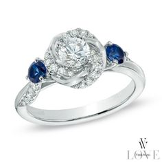 a white gold ring with blue sapphires and diamonds