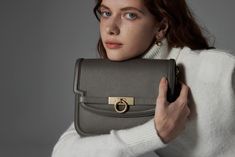 Introducing the Grace Flap Bag, a timeless embodiment of classic elegance. This exquisite bag elevates sophistication with its signature lock closure, inspired by a vintage door handle. Crafted with full-grain calfskin from USA, this versatile companion strikes a harmonious balance between modern minimalism and timeless charm. Timeless Satchel With Gold-tone Hardware, Elegant Leather Flap Bag With Turn-lock Closure, Elegant Top Handle Bag With Turn-lock Closure, Timeless Formal Bag With Lock, Timeless Formal Shoulder Bag With Lock, Timeless Top Handle Flap Bag, Timeless Flap Bag With Gold-tone Hardware, Timeless Rectangular Satchel For Everyday Luxury, Timeless Shoulder Bag Satchel