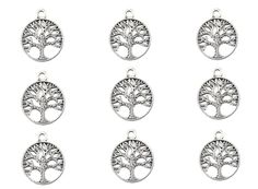 six silver tone tree charms on a white background