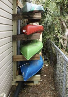 a stack of canoes sitting on top of a wooden pallet