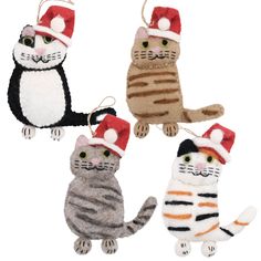 four cat ornaments in different colors and sizes