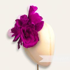 This extra large wired hat mount is EVERYTHING! Made up of two large blooms and four flower buds, this flower mount is entirely made from velvet with a touch of organza! Each petal has been carefully pressed to reveal a beautifully intricate pattern and has two stems of veined and wired leaves backing it.  Total mount length: 20cm (7.9 inches) For our full range of velvet hat flowers visit our Etsy shop here! www.etsy.com/shop/Petershams Orders are posted daily from Canterbury, England with expected delivery times of: Within the UK: 1-5 working days (by 1st Class Post) Outside the UK: 5-15 working days (by Standard Airmail) Upgraded traceable priority services are available for an extra cost at checkout. Garden Party Flower Hat With Handmade Flowers, Handmade Flower Headpieces For Garden Party, Kentucky Derby Handmade Flower Hair Accessories, Flower Headpieces For Kentucky Derby, Kentucky Derby Flower Hair Accessories, Handmade Flower Hat For Kentucky Derby, Kentucky Derby Flower Headband With Handmade Flowers, Kentucky Derby Handmade Flower Headband, Floral Kentucky Derby Hats With Handmade Flowers