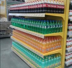 the shelves are filled with bottles of soda