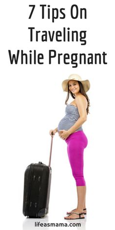 a pregnant woman with a suitcase posing for the camera