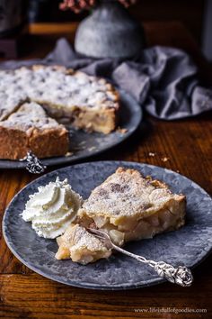 two plates with slices of pie and whipped cream