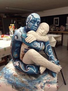 a blue and white statue sitting on top of a table