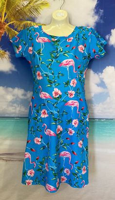 This is a beautiful modest swim dress that is perfect for ladies of all ages and sizes. The full coverage design and high-quality fabric make it a good item to wear as a swimsuit in the water or as a swim dress for the beach. This modest swimsuit is close to knee-length and has leggings attached underneath. Size Chart:  XS- chest-31-32", waist-26", hips-34"  S- chest-33-34", waist-27-28", hips-36"  M- chest-35-36", waist-29-30",hips-38"  L- chest-37-38", waist-31-33", hips-42" XL-chest-40-42", waist-34-36", hips-45" 2XL- chest-44-46", waist- 38-42", hips-50" 3XL- chest- 48-50", waist-44-48", hips-55" 4XL-chest- 52-55", waist- 48-52", hips-60" 5XL- chest- 56-60", waist- 54-58", hips-65" Fitted Tropical Swim Dress For Poolside, Beach Swim Dress With Short Sleeves, Fitted Short Sleeve Swim Dress For Beach Season, Fitted Short Sleeve Swim Dress For Beach, Fitted Short Sleeve Summer Swimwear, Fitted Short Sleeve Swim Dress For Summer, Fitted Short Sleeve Summer Swim Dress, Fitted Tropical Swim Dress For Beach Season, Fitted Spring Swimwear With Short Sleeve