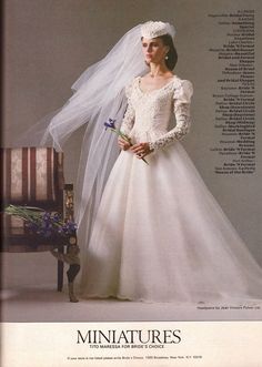 a woman in a white wedding dress and veil