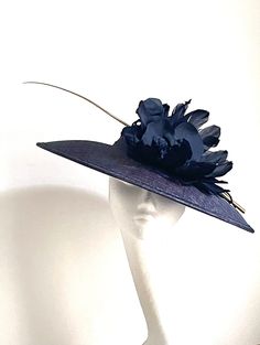 Purple disc hat This amazing navy purple disc hat is made of sinamay fabric. On the side is attached matching silk flower and feathers. There is a long hand painted gold feather to make a statement of the hat. The hat will be an amazing accessory to compliment your outfit. It will fit the average head size. It has a black rubber band for extra security. You can wear this amazing hat at the wedding, Christening, Horse races and any other special occasion. Enjoy! xx Bow Fascinator, Mother Of The Bride Hats, Sinamay Fabric, Black Rubber Bands, Blue Disc, Horse Races, Royal Ascot Hats, Bride Hat, Wedding Hat