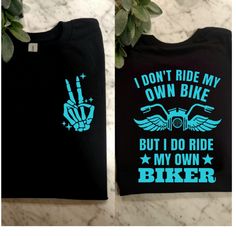 two t - shirts that say i don't ride my own bike but i do ride my own biker