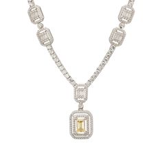 Discover unparalleled elegance with the Evita Lemon Topaz Statement Necklace in Silver. This stunning piece embodies luxury through its tennis necklace design. At its heart lies a captivating pendant drop with two distinct rectangular settings. The larger of these settings showcases a radiant lab-grown lemon topaz, surrounded by two shimmering rows of zircons. This exquisite element is seamlessly connected to a smaller rectangular setting adorned with baguette-cut zircons, encircled by a single Elegant Gemstone Tennis Necklace For Anniversary, Luxury Baguette Cut Solitaire Necklace, Luxury Cubic Zirconia Necklace With Rectangular Pendant, Luxury Silver Emerald-cut Diamond Necklace, Luxury Gemstone Tennis Necklace, Luxury Silver Gemstone Tennis Necklace, Luxury Gold-plated Necklace With Rectangular Pendant, Luxury Emerald-cut Diamond Necklace In Sterling Silver, Luxury Silver Citrine Necklace