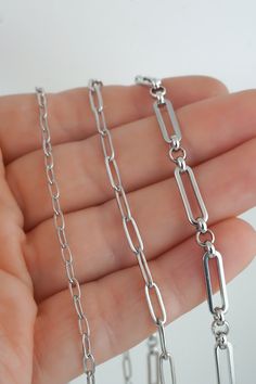 These unisex stainless steel paper clip chain necklaces are great for layering and everyday wear.  The chains are available in 3 sizes as shown:   - Small: 4.5 x 2.5 mm - Medium: 9 x 3 mm - Large: 14 x 4 mm ♥  Packaging ♥ Each of our chain necklaces come in a jewelry box with a jewelry backing card. On the jewelry card, we can use our standard logo background, or you can provide a Gift Message when you pay and we will create a custom jewelry card for you. Looking for more stainless steel jewelry? Check out our collection: https://www.etsy.com/shop/charmphilosophygifts ♥ SHIPPING INFO ♥ We ship twice a week, usually Mondays and Thursdays (shipping days may vary around the holidays and week's with long weekends). To USA: - Provider: Chit Chats Express (who deals directly with USPS) - Arrival Silver Paperclip Necklace, Paper Clip Chain Necklace, Paper Clip Necklace, Chain Link Necklace Silver, Chain Necklace Silver, Paperclip Necklace, Chit Chat, Necklace Layering, Jewelry Card