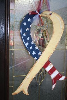 a patriotic ribbon is hanging on the front door