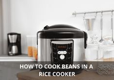 an electric rice cooker with the words how to cook beans in a rice cooker