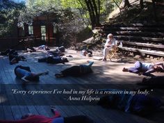 there are many people laying on the ground in front of some stairs with a quote above them