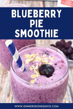 blueberry pie smoothie in a glass with a straw