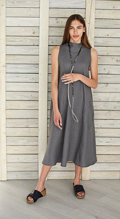 "Linen flare dress / Extravagant linen dress / Long linen summer dress / Stylish maternity dress / Linen circle loose dress / Graphite The linen flare dress is very stylish and comfortable, with two big pockets in front. In front of the dress there is triangular detail, the collar of dress with two buttons. It is made from washed and softened medium weight natural Lithuanian linen. Comfortable linen dress hand made from pre washed linen fabric. You can choose from 16 colors. (The color palette y Gray Linen Dress For Summer, Gray Midi Length Dress For The Beach, Gray Midi Length Dress For Beach, Elegant Flowy Sleeveless Linen Dress, Lagenlook Linen Beach Dress, Gray Midi Length Beach Dress, Gray Midi Dress For Beach, Flowy Linen A-line Dress, Gray Linen Summer Dress