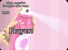 a pink spray bottle with the words prayer written on it, and an image of a hand spraying water