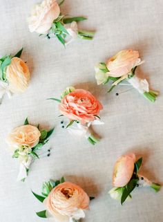 the flowers are arranged on the table cloth