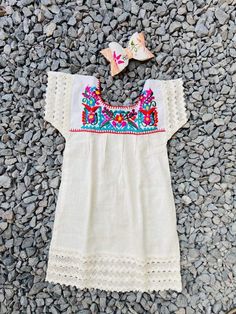 "Unique and beautiful embroidered dress includes the matching bow. Dimensions Size 4T Lenght 23\" Bust 12\" You can always exchange it for a bigger or smaller size. (Buyer is responsible for both shipping costs if an exchange is necessary) Please let me know if you have questions about the product, I'll be more than happy to help you :) I do not accept returns, but contact me if you have some inquiries. *Returns: We do not issue refunds. We will only allow exchanges within 3 days from date recei White Embroidered Dress For Cinco De Mayo, Embroidered Summer Baptism Dress, Embroidered Summer Dresses For Baptism, Cinco De Mayo White Embroidered Dress, Baby Mexican Dress, Fiesta Outfit, Mexican Outfit, Mexican Dresses, Girls Party Dress