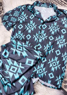 Unleash your inner cowgirl with our Black & Turquoise Aztec Silky Pajamas. With a touch of western flair, these pajamas will have you sleeping well and feeling stylish all night long. Comfortable and chic, these pajamas are a must-have for any cowgirl's wardrobe. 97% polyester and 3% spandex - silky soft Loose fit Elastic waist Button Top True to size, size up if you prefer more room Model is wearing a Small, 125lb, 5'3" Size chart in photos See delivery chart for estimated arrival time Cute Country Gifts, Western Pjs For Women, Western Pajamas Women, Cowgirl Pjs, Country Pajamas, Western Pajamas, Western Pjs, Western Gift Ideas, Western Fashion Jewelry