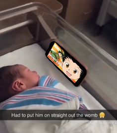 a baby laying in a bed with an app on it's screen showing him