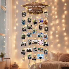 a bedroom decorated with lights and pictures on the wall