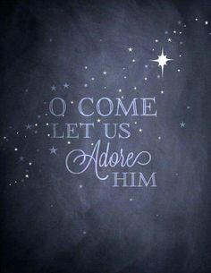 a chalkboard with the words o come let us adore him