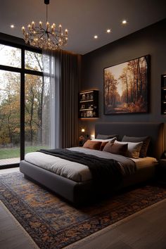 a large bed sitting next to a tall window in a bedroom under a chandelier