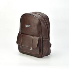 Take your essentials with you on traveling with our must-have leather backpack. This stylish leather backpack in dark brown would protect your valuables and is easy to carry. In addition, this bag, made of Cowhide leather, offers durability and protection for your daily carry. Moreover, this leather backpack has a sleek design and color. The Leather straps are soft so that you can feel comfortable. This leather backpack has a good space and can keep all your necessities, such as your laptop, ele Brown Leather Backpack For Students, Brown Student Backpack, Brown Soft Leather Backpack For School, Brown Soft Leather School Backpack, Brown Backpack For Daily Use, Brown Leather Student Backpack, Classic Brown Backpack For School, Classic Brown School Backpack, Modern Brown Leather Backpack With Luggage Sleeve