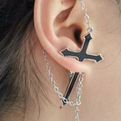 [Brand New] Pierce The Ear With A Cross, Creating A Unique Accent That Is Perfect Not Only For Classic Goths But Also For Those Who Prefer To Carry Their Cross In A Different Way. This Unique Earring Is Simple In Its Design, Appearing As A Black Enameled Cross Fitted With A Draped Chain. When Worn, The Cross Seemingly Pierces The Ear While The Chain Drapes Over The Ear. The Earring Is Made In Pewter And Fitted With A Stainless Surgical Steel Post For Wearing. It Is Sold As A Single Earring. --In Rock Punk Style, Cross Earring, Hello Kitty Earrings, Earring Piercing, Heart Piercing, Unique Earring, Layered Choker Necklace, Choker Collar Necklace, Layered Necklaces Silver