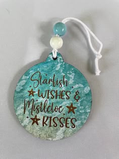 a ceramic ornament with words on it that says, starfish wishes and mistie kisses