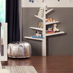 a baby's room with a book shelf and crib