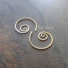 Small 14k gold filled spiral hoop earrings. Petite AND make a statement: win- win! Formed and cold forged from 20 gauge 14k gold filled wire into this small coil. The ends have been sanded for comfort in wearing, then polished to a light shine. * Small spiral hoop earrings are approximately 17mm in diameter. Please see measurement photo. You can also choose sterling silver at the dropdown to the right. If you are looking for the larger version of this style click here: https://www.etsy.com/listi Gold Spiral Wire Wrapped Hoop Earrings, Gold Minimalist Spiral Wrap Earrings, Minimalist Gold Spiral Wrap Earrings, Gold Spiral Hoop Earrings Nickel Free, Gold Spiral Hoop Earrings Nickel-free, Gold Spiral Hoop Earrings Gift, Nickel-free Spiral Gold Hoop Earrings, Gold Spiral Wrap Earrings Nickel Free, Gold Spiral Wrap Earrings With Ear Wire