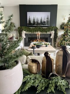 a living room filled with furniture and a fire place covered in christmas decorations next to a fireplace