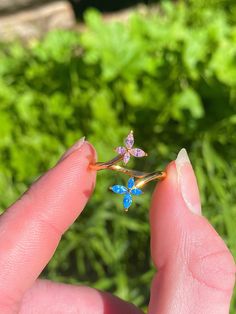 The Bella Butterfly Ring is the perfect spring/summer accessory that will bring you joy at every glance! Made with real 18k gold and 925 Sterling silver, this ring will always look beautiful and also a lifetime. Makes for a great gift for you or a friend!  Designed by JuneBugFantasies* -exclusive design that cannot be found in any other shop, retailer, or website  -original design by shop owner Adjustable** Tarnish/Water Resistant** Materials  -925 Sterling Silver+18k Gold plating  -Cubic zirconia (pink and blue) Made with love <3 Minimalist Gold Jewelry, Gold Jewelry Aesthetic, Gold Minimalist Jewelry, Jewelry Aesthetic, Butterfly Ring, Shop Owner, Look Beautiful, Dainty Jewelry, Cute Gift