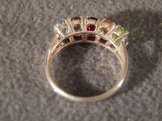 I am offering you this spectacular sterling silver vintage ring. This piece is distinctive and beautiful with stunning styling. * sterling silver multi-gem ring * genuine amethyst, peridot, garnet, citrine and blue topaz oval individually set stones * classic band * size 7 1/2 This ring was discovered in an estate sale here in upstate New York. This item is sold in as-is condition. Buyer pays all shipping and handling. Vintage Multi-stone Gemstones For Wedding, Silver Oval Gemstones For Wedding, Classic Silver Multi-stone Gemstones, Classic Silver Amethyst Ring With Multi-stone, Silver Multi-stone Oval Crystal Ring, Silver Oval Multi-stone Gemstones, Oval Silver Multi-stone Gemstones, Oval Multi-stone Silver Crystal Ring, Silver Multi-stone Topaz Ring With Round Cut