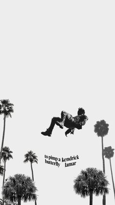 a man flying through the air while riding a skateboard in front of palm trees