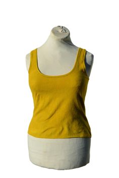 Cropped vest top handmade in small batches. Ethical and sustainable garments made here in the mountains of Portugal. Earthy, minimalist, alternative style. Created from soft stretchy cotton fleece with fluffy side out. Hand dyed with low impact colours in vibrant summer yellow with mottling. Midi length - sits above navel. Deep scoop neckline to front and back. Raw hemline. Hand or machine wash at 30'c, air dry or tumble as cotton and iron on medium setting. See size chart in last image. See more of my handmade crop tops here: https://www.etsy.com/shop/DarkWilds?ref=l2-shopheader-name&section_id=21759017 Head back to my main store page here: https://www.etsy.com/shop/DarkWilds Fitted Yellow Scoop Neck Top, Yellow Sleeveless Crop Top For Festival, Fitted Mustard Sleeveless Top, Fitted Yellow Tank Top, Mustard Fitted Sleeveless Top, Yellow Fitted Tank Top, Yellow Stretch Cropped Tank Top, Yellow Stretch Crop Top Tank, Yellow Cotton Crop Top Tank