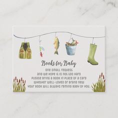 a baby shower card with clothes hanging on a line and fish in the buckets